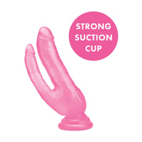 a pink plastic penis sitting on top of a white background