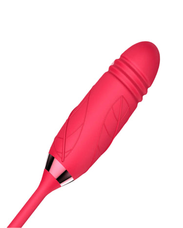 a woman laying in bed with a pink vibrating device