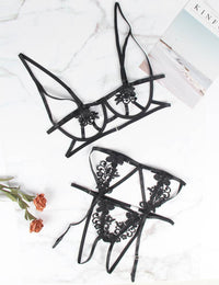 a pair of black eye glasses sitting on top of a table