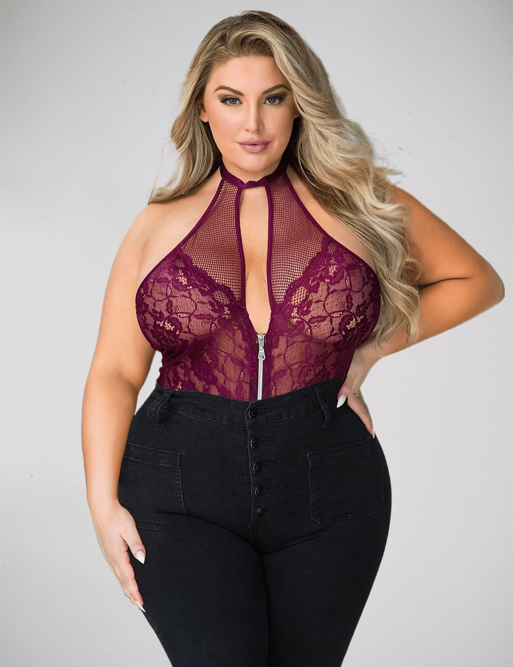 a woman wearing a purple top and black pants