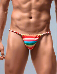 a man wearing a colorful striped bikini bottom
