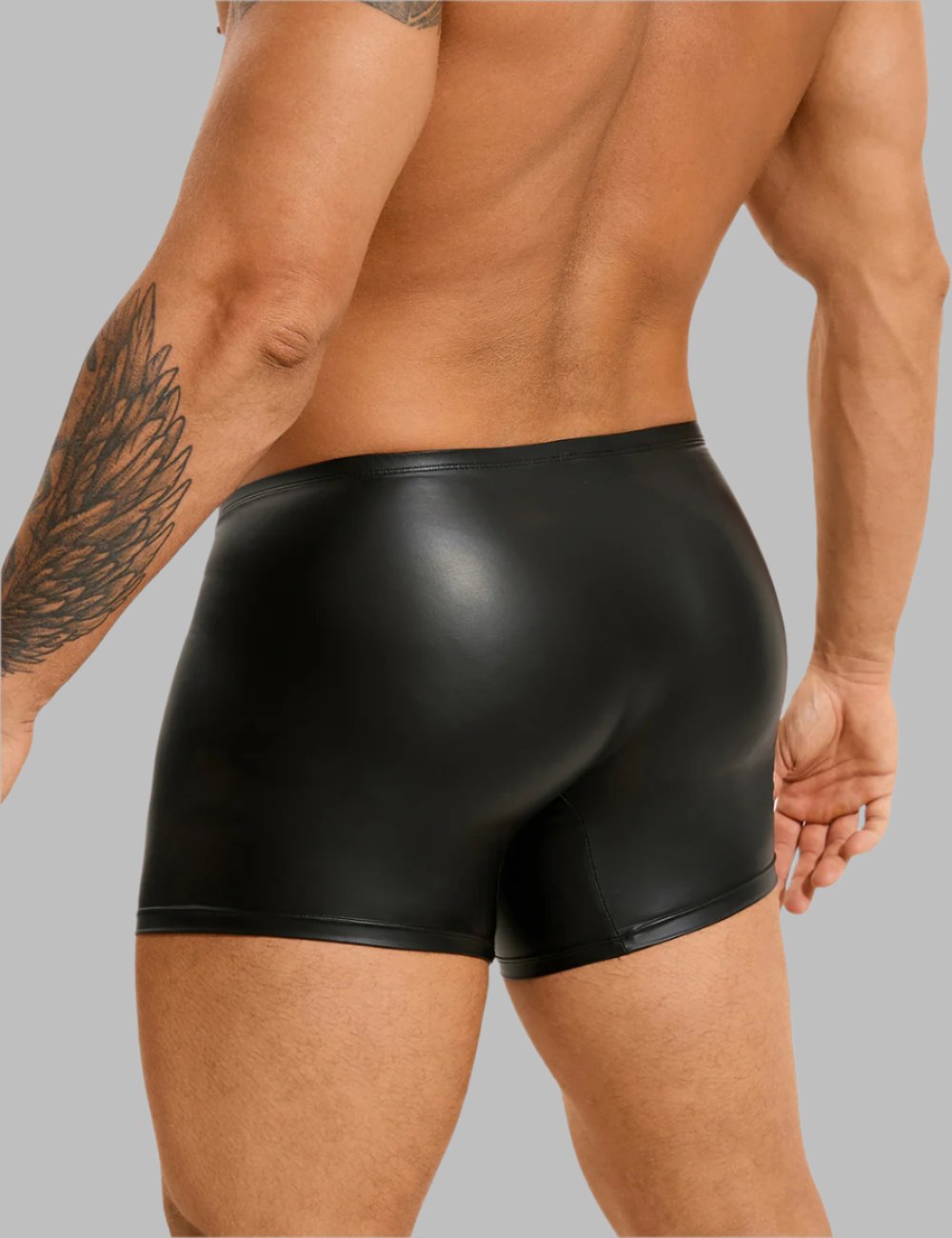 a man wearing a black leather boxer shorts
