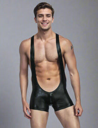 a man in a black leather suit posing for a picture