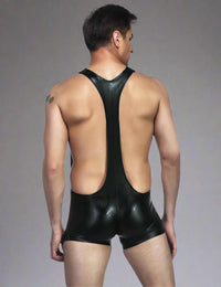 a man in a black leather suit with his back to the camera