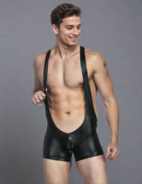 a man wearing a black leather bib and suspenders