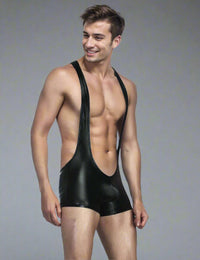 a man in a black wetsuit posing for a picture