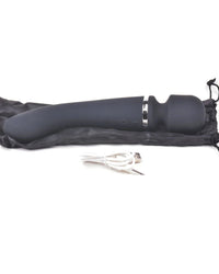 a pair of scissors laying on top of a black bag