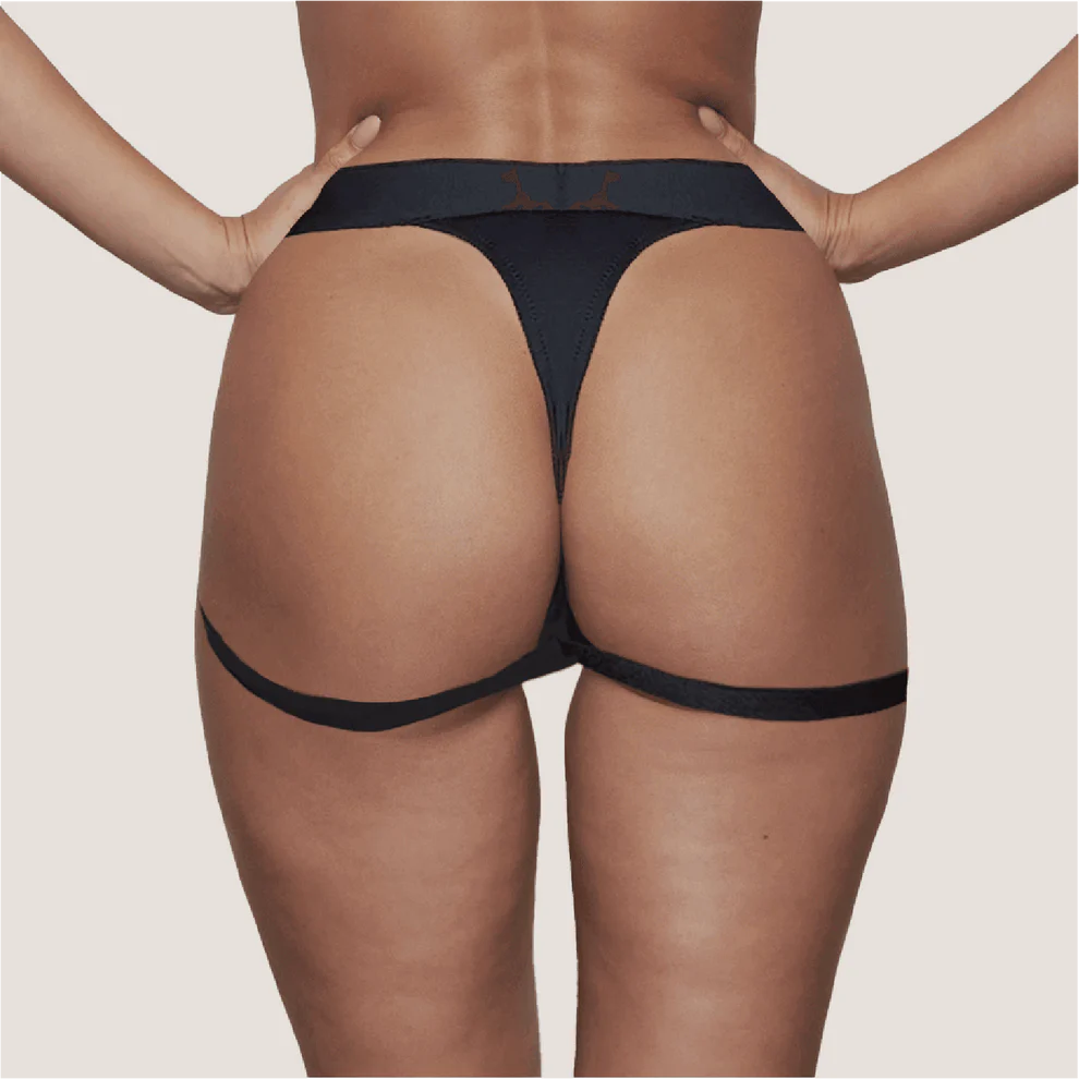 Artistic representation of the Flux Strap-On Harness, underlining its machine-washable, vibe-compatible features designed for enhanced sapphic pleasure.