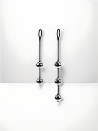 a pair of black hooks on a white wall