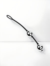 a close up of a black and white clock on a wall