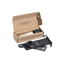 Doxy Go - Brushed Metal in a luxurious environment, highlighting the portability of the doxy mini wand.