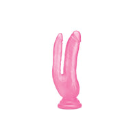 a pink plastic toy shaped like a worm