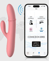 a phone and a pink dilll next to each other