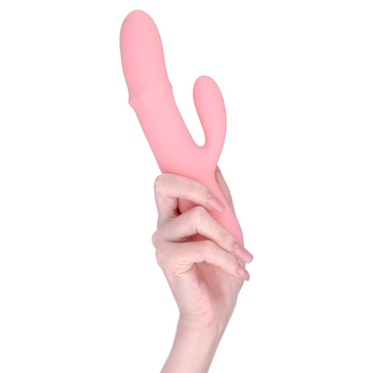 a person holding a pink object in their hand