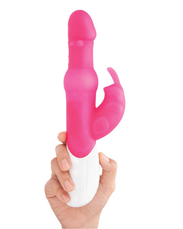 a person holding a pink and white rabbit vibrator in their hand