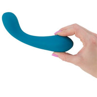 a person holding The Swan Curve - Squeeze Control G-Spot Vibrator in Teal