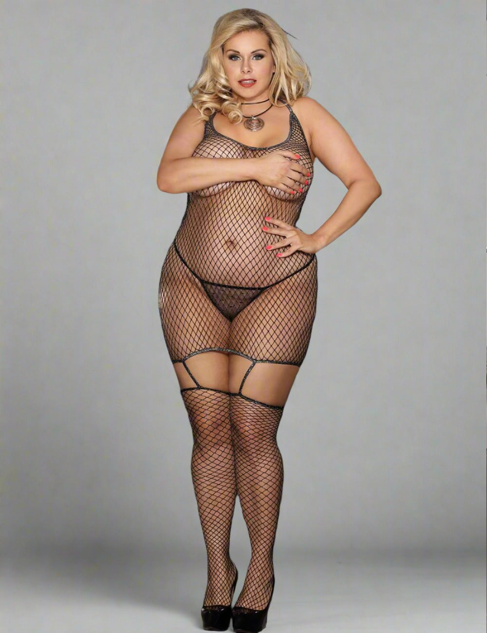 a woman wearing a fishnet bodystocker and stockings