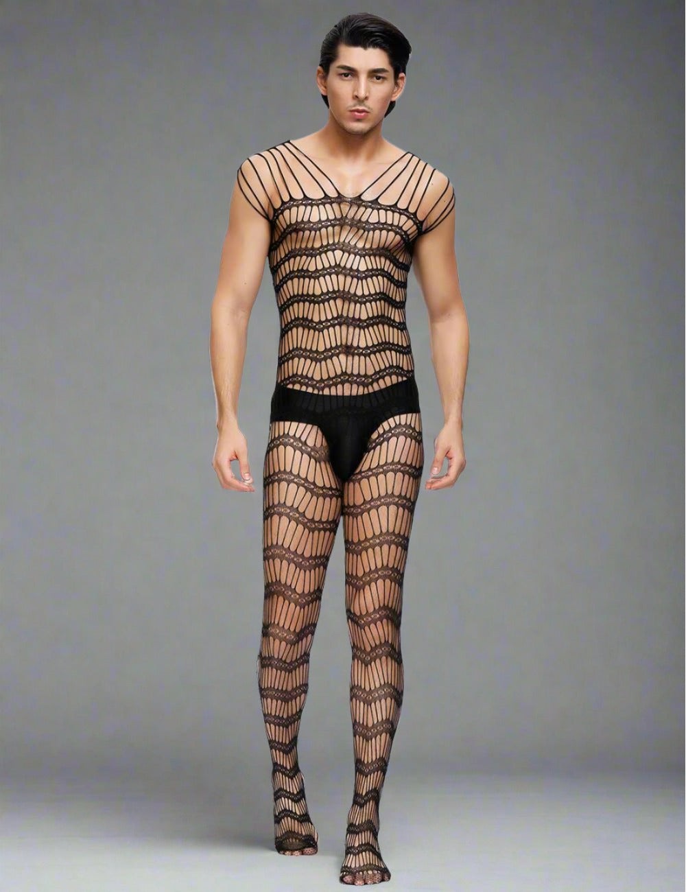 a man in a fishnet bodystockt and fishnet stockings