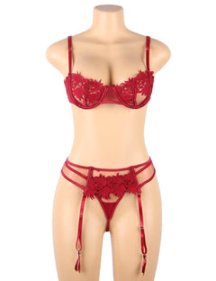 a female mannequin wearing a red lingerie