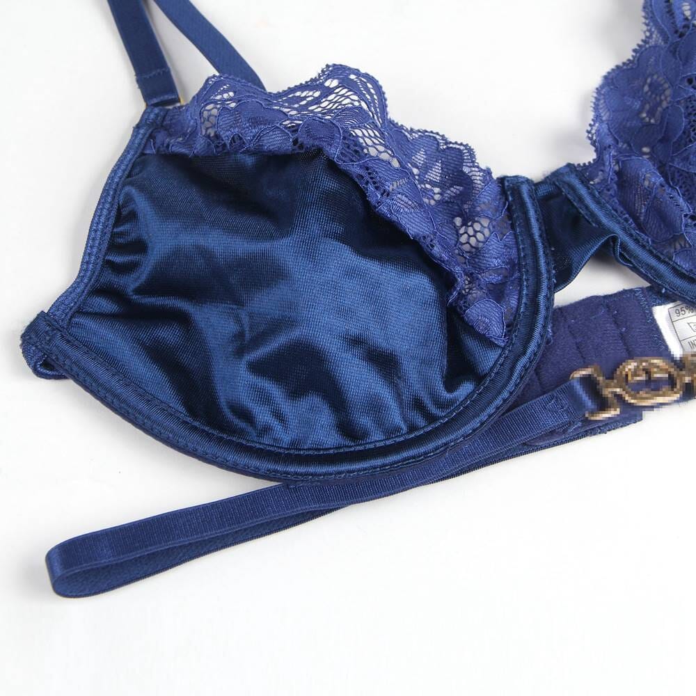 a blue bra with a gold buckle on a white background