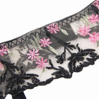Thumbnail for a black and white lace with pink flowers on it