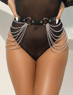 a woman in a black bodysuit with chains around her waist