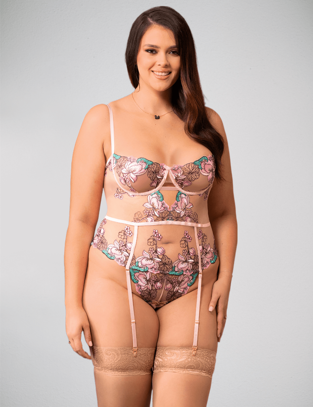 Pink floral lingerie teddy by Scandals Lingerie, colorful and sexy body suit with delicate floral design and feminine fit.