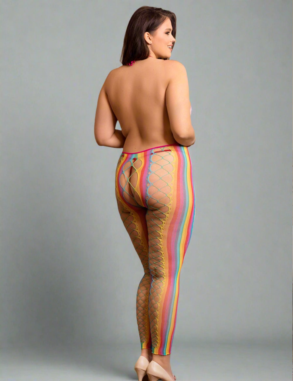 a woman with a very large breast wearing a colorful patterned leggings