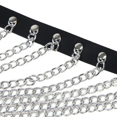 Black chain chest harness by Scandals featuring metal links and adjustable straps, designed for BDSM and fashion wear.