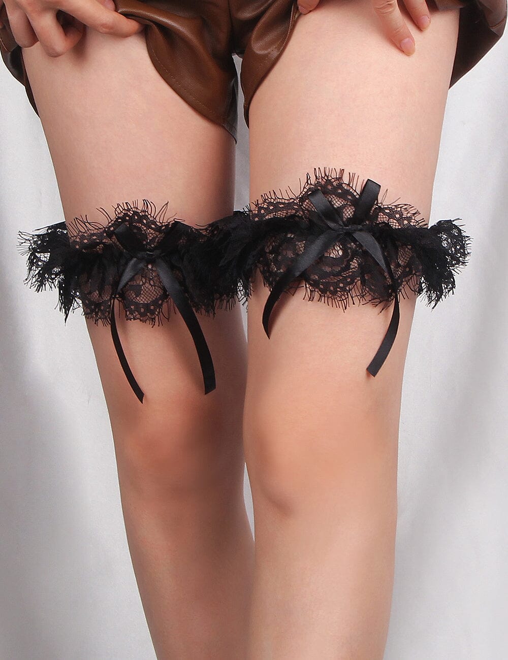 a close up of a person wearing garters