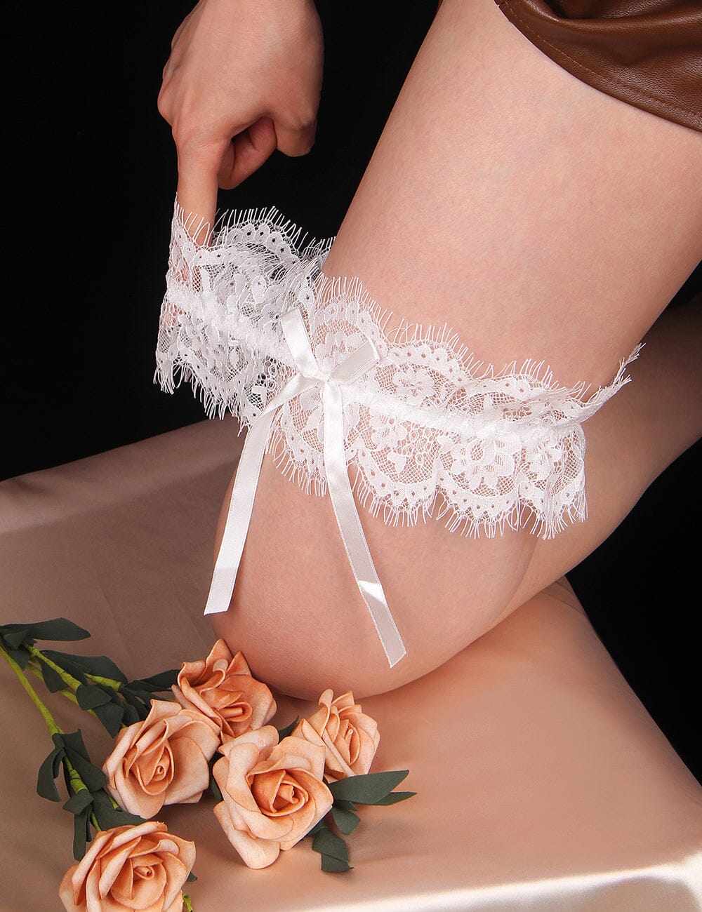 a close up of a person wearing a garter