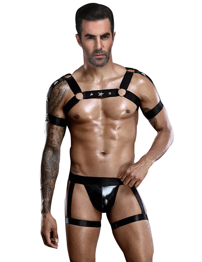 a man wearing a black harness and underwear