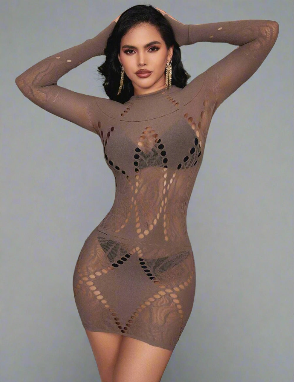 a woman in a bodysuit posing for a picture