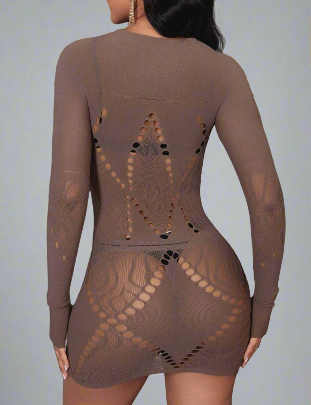 a woman in a bodysuit that has holes on it