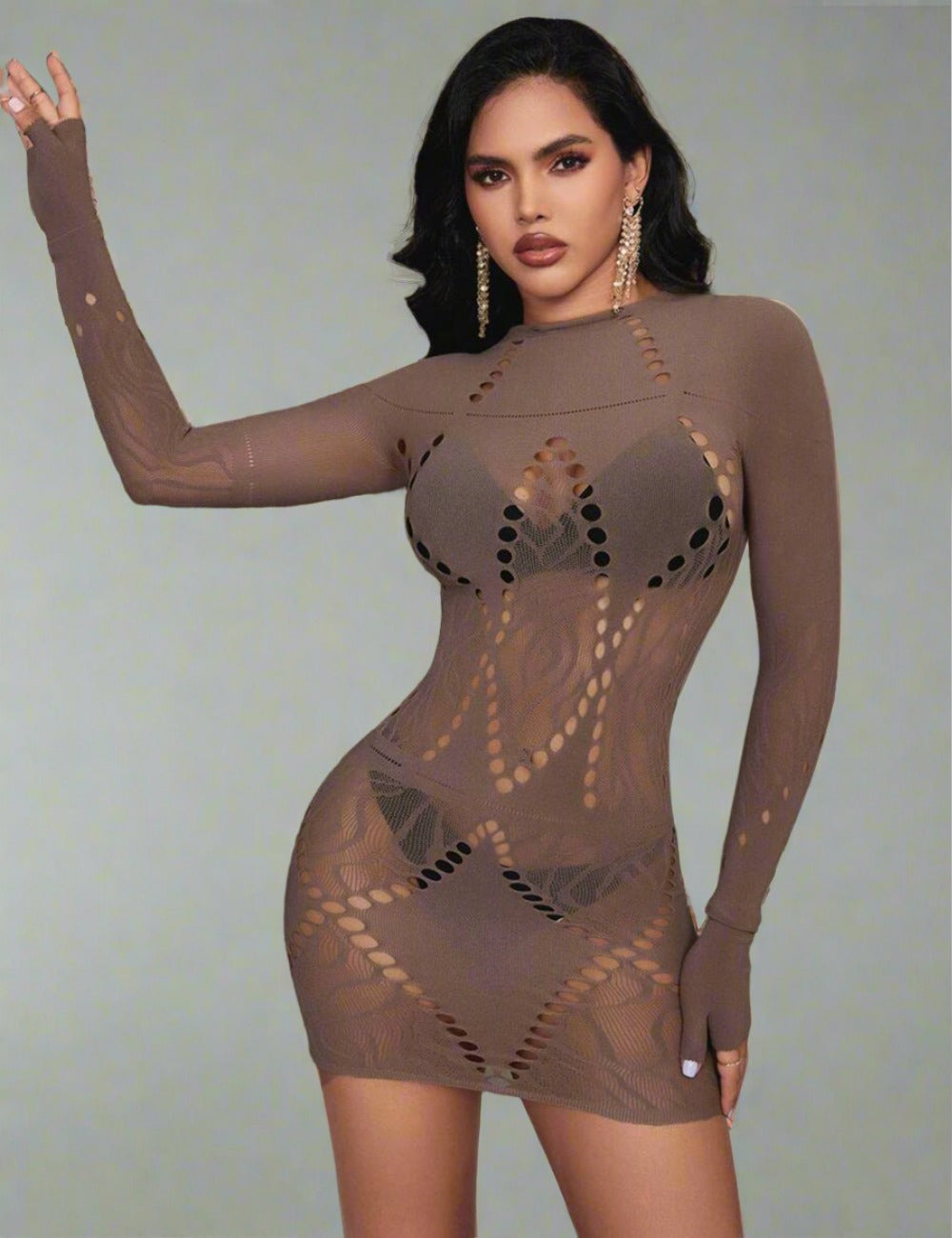 a woman in a bodysuit posing for a picture