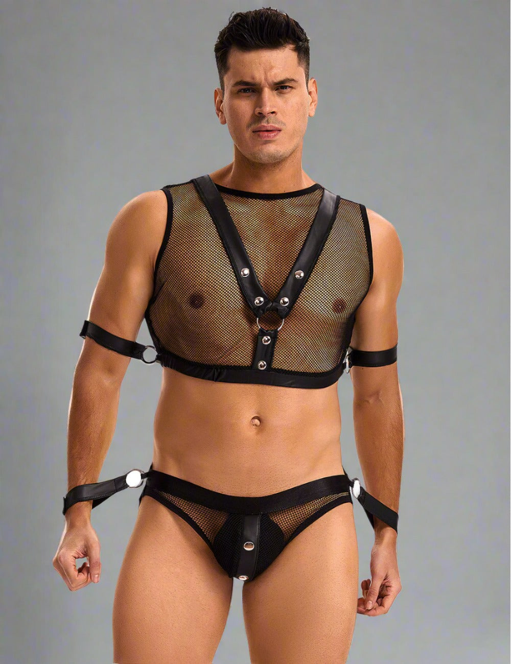 a man wearing a black lingerie and suspenders