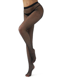 a woman in a black thong and black fishnet diamond stockings with one leg bent seductivdely