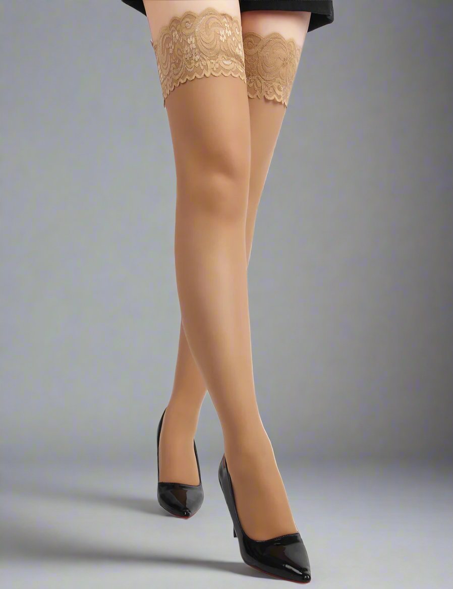 a woman wearing a pair of nude lace top seam detail stockings by scandals and high heels