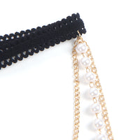 Stylish display of the Gold Sexy Pearl Detail Chain Leg Ring Garter on a soft surface, accentuating its luxury appeal.