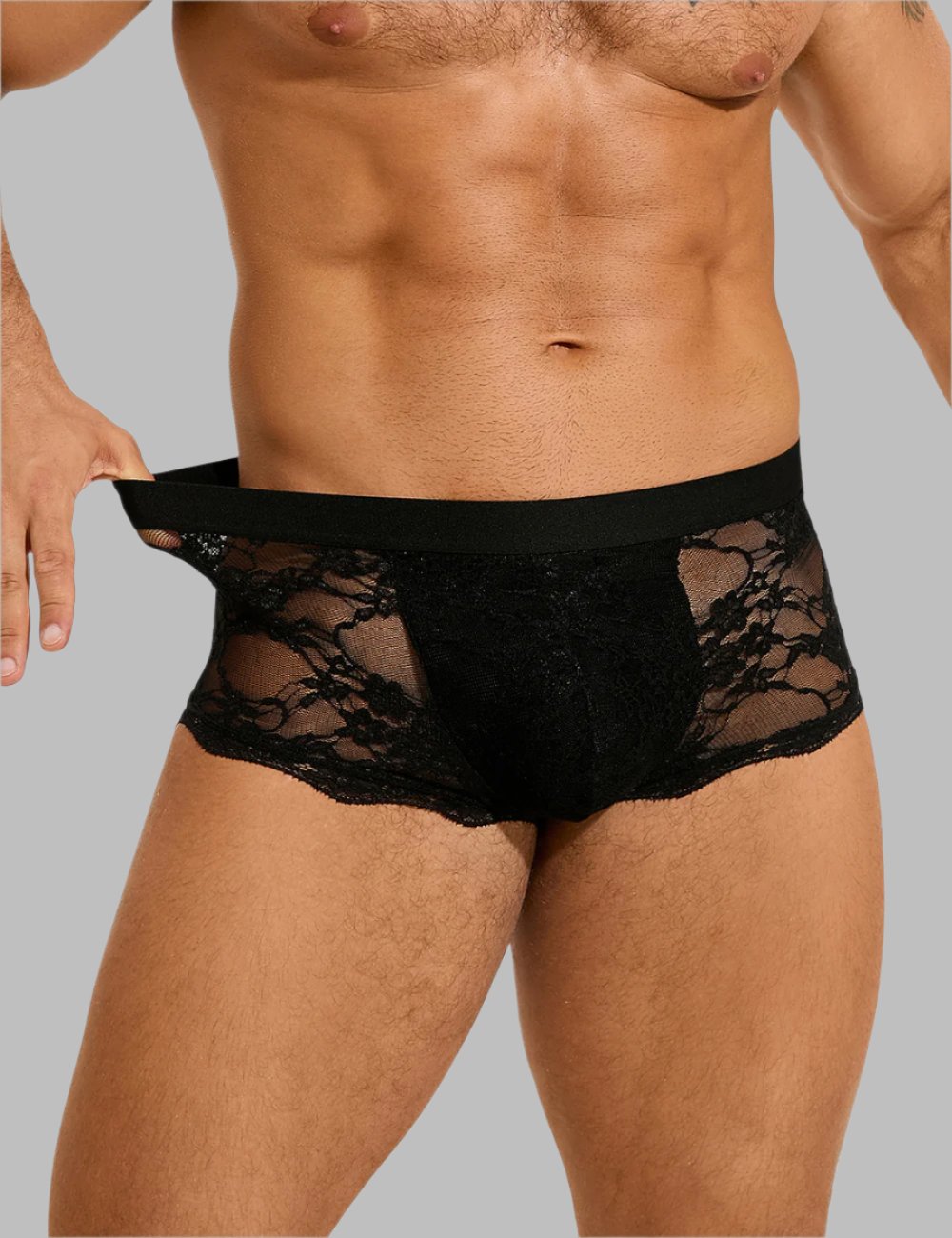 a man in a black underwear with a lace pattern