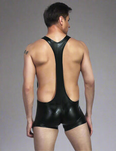 a man in a black leather suit with his back to the camera