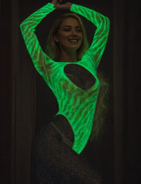 Stunning view of the White Sexy Open Chest Luminous Bodysuit, focusing on the unique glow-in-the-dark effect and premium quality materials.