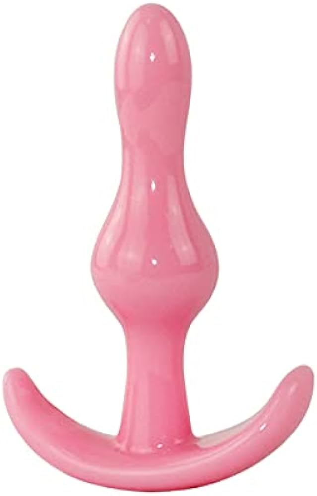 a pink sex toy sitting on top of a white table