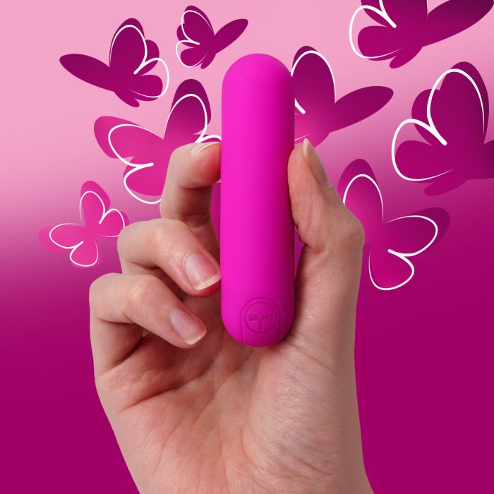 a person holding a pink object in their hand