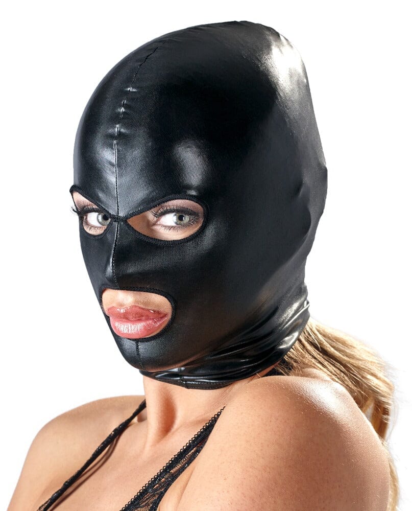 a woman wearing a black latex mask