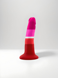 Avant Lesbian Pride Silicone Suction Dildo positioned upright, showcasing its vibrant pink and red stripes, exemplifying luxury and pride in intimate accessories.