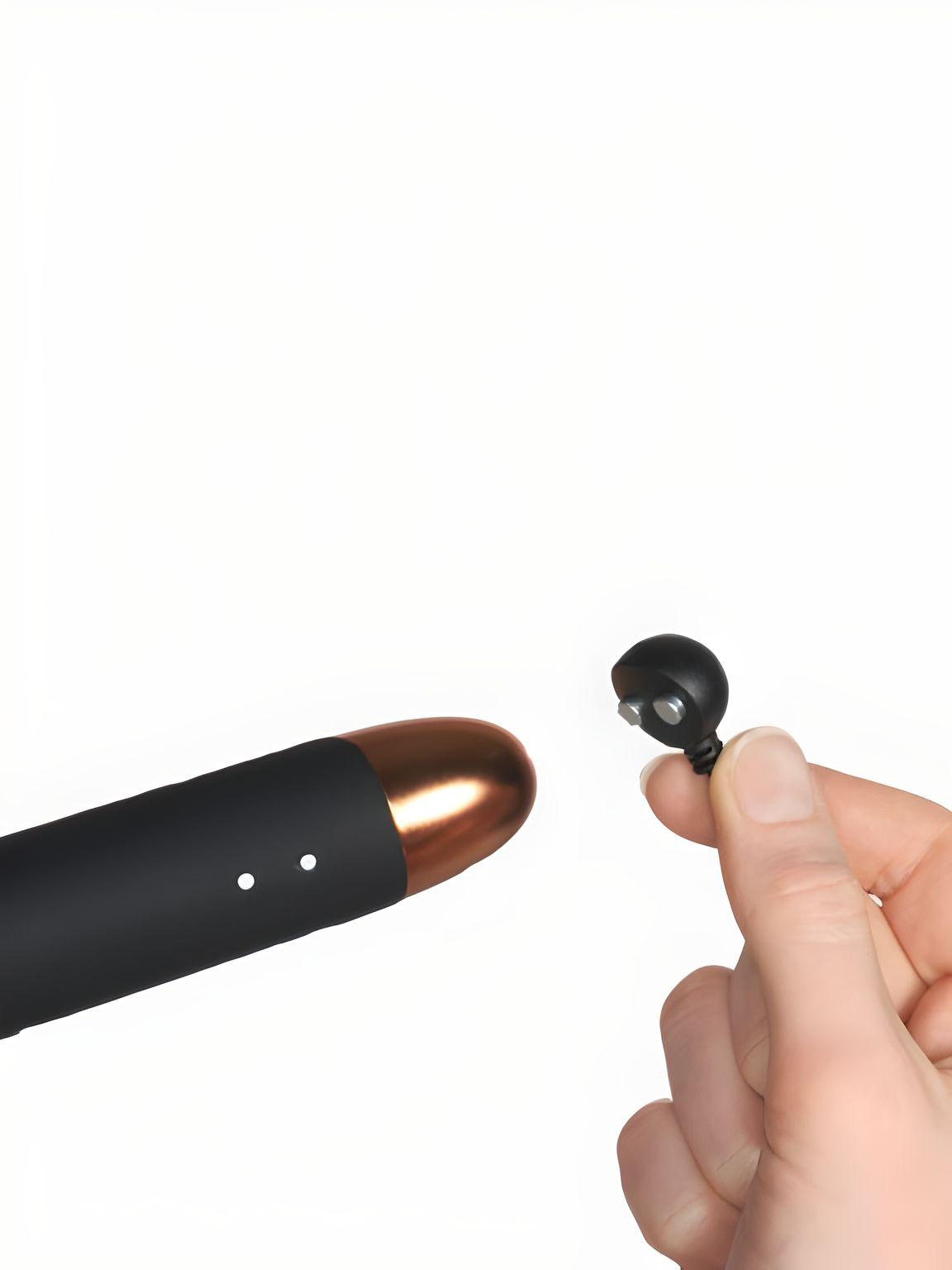 Close-up of the Rocks Off Oriel Ultimate Couples Play Wand Vibrator, demonstrating its magnetic USB charging feature. This wand vibrator combines luxury with practicality for an enhanced intimate experience.