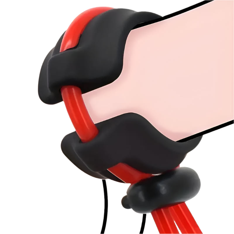 Close-up of the adjustable silicone cock ring being worn, showcasing its ergonomic design and dual colour combination of black and red for aesthetic appeal.