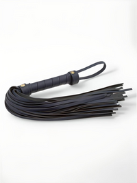 Faux Leather Soft Flogger Bondage Couture by NS Novelties, showcasing soft vegan leather strands and a sturdy wrapped handle for an elegant BDSM experience.