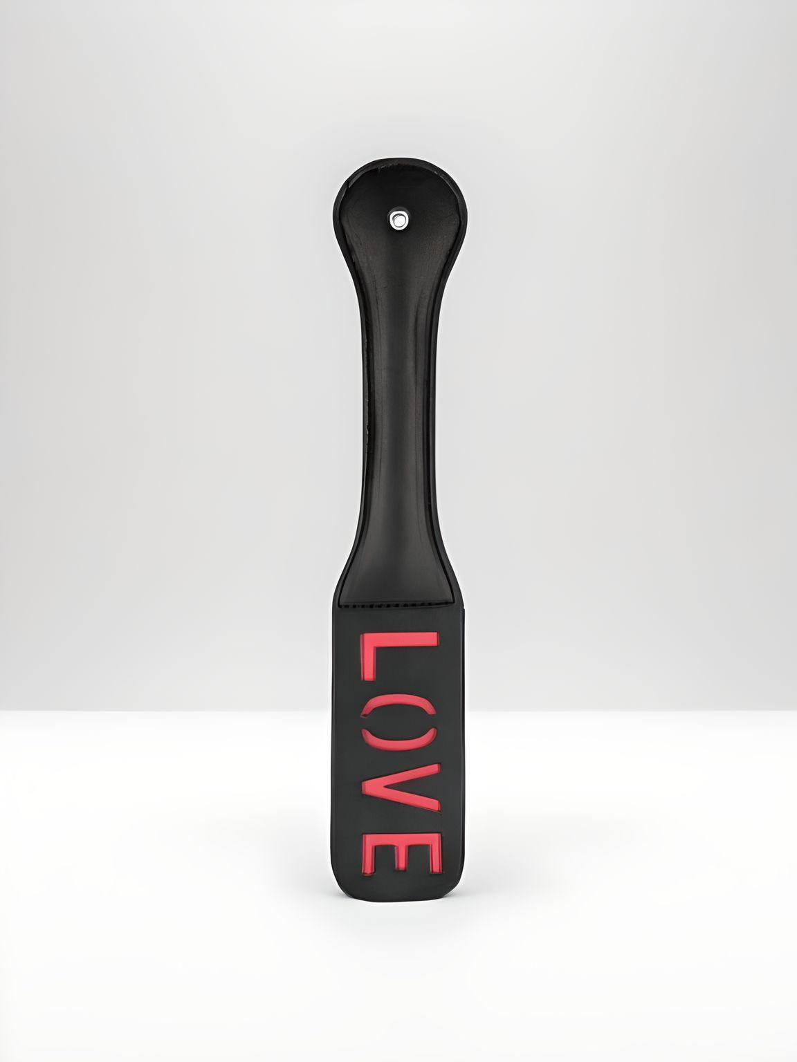 Love Imprint Paddle by Scandals, premium faux leather, flexible design for lasting impressions on skin, part of whips and paddles collection.